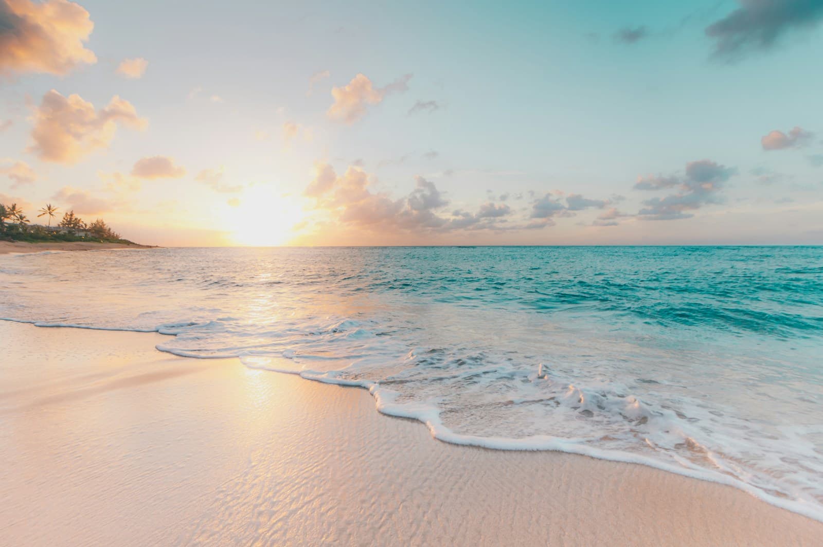 Sunlit beach and turquoise sea